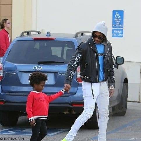 Rapper Future with Son Future Zahir Wilburn in LA wearing Red Burberry Sweatshirt