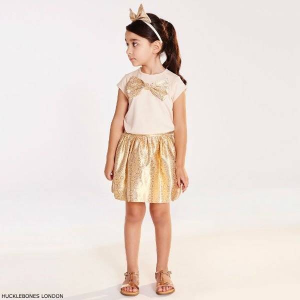HUCKLEBONES LONDON Girls Pink Top with Gold Bow & Gold Jacquard Skirt